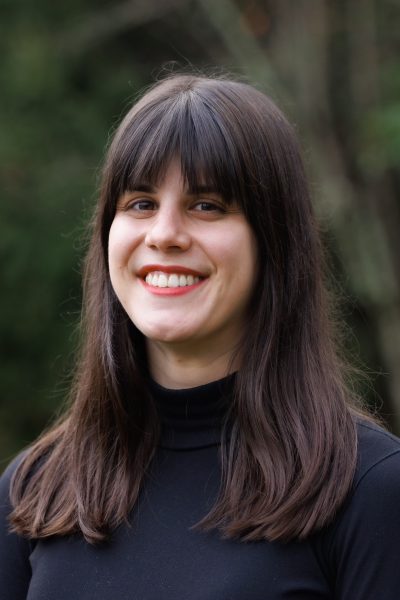Casey Stern, therapist at Kind Mind Psychology, smiling outdoors